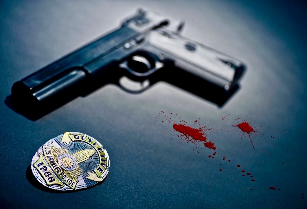 police badge and gun